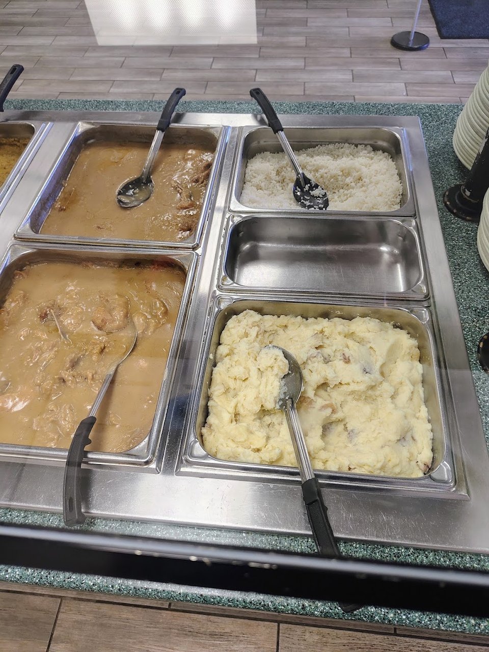 Lunch and dinner buffet with cobbler and pudding.