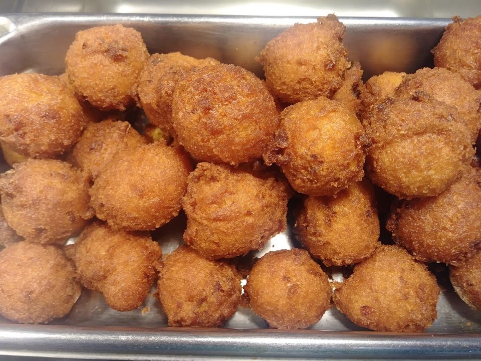 Southern sides listed beside fried chicken and rolls.